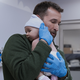 Dr. Robby (Noah Wyle) holding a baby on 'The Pitt'