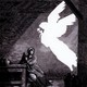 Black-and-white illustration with an etching of a biblical woman visited by the empty white silhouette of a winged angel