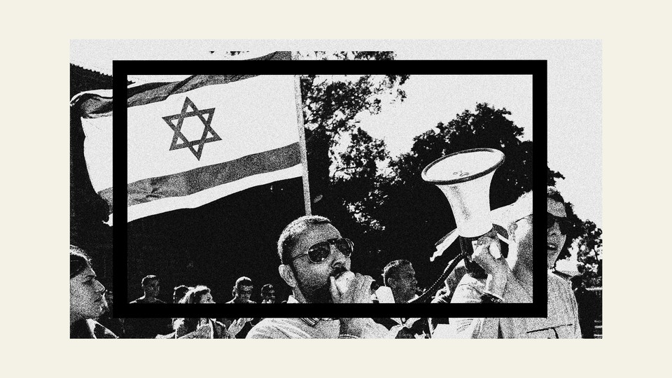 A man speaking into a microphone at a protest in support of Israel