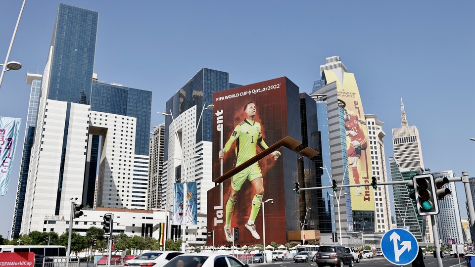A Doha, Qatar, cityscape shows promotional displays for the 2022 World Cup.
