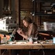 Annie Graham (Toni Collette) working in her home studio in the film 'Hereditary.'