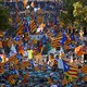 Pro-independence protesters wave Catalan flags
