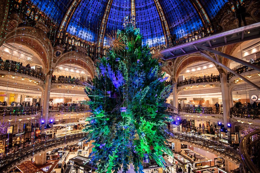 A huge Christmas tree stands inside a circular atrium.