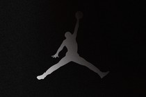 A Jordan "jumpman" logo that is fading into black