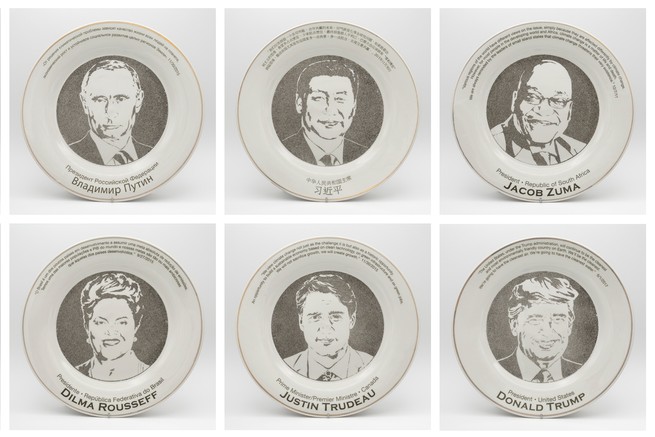 Portraits on plates of Vladimir Putin, Xi Jinping, Jacob Zuma, Dilma Rousseff, Justin Trudeau, and Donald Trump.