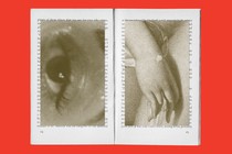 open book with images of an eye and a hand juxtaposed on top of the pages