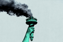 The Statue of Liberty's torch has dark smoke pouring out of it