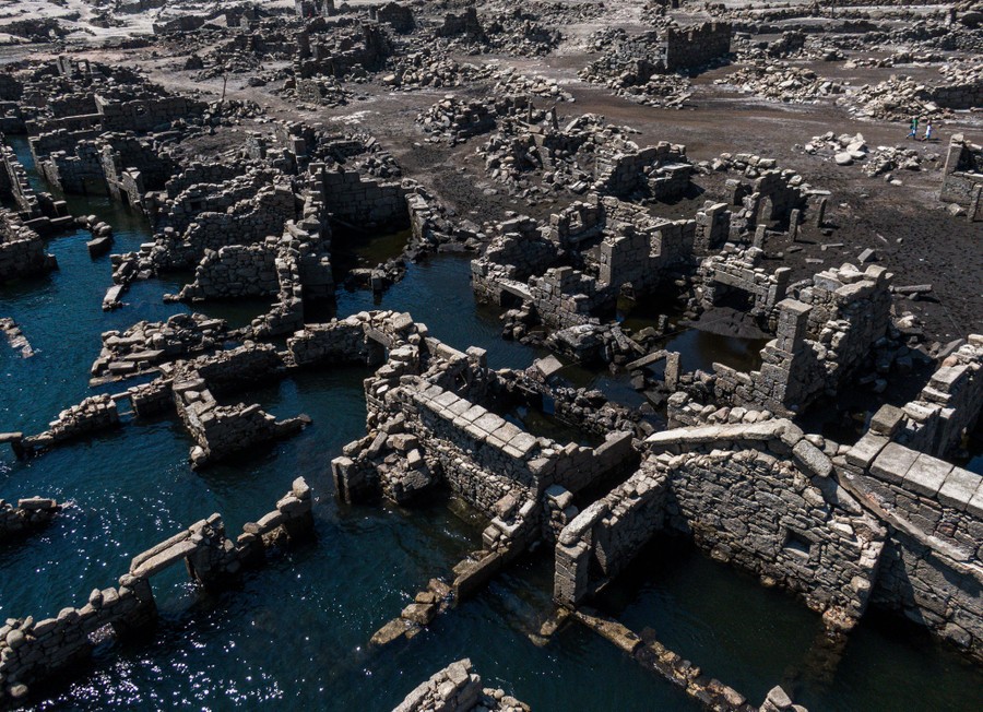 An aerial view of stone walls—the ruins of a village flooded more than 60 years ago