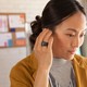 A marketing photo of a woman wearing an Amazon Loop
