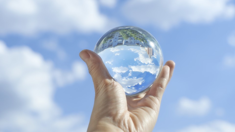 A crystal ball under a pleasant blue sky