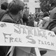 College student holding "On Strike for Free Speech" sign at protest
