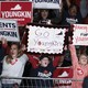 People holding signs reading "Parents for Youngkin," "Go Youngkin," and "Youngins for Youngkin"