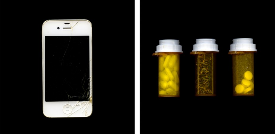 photograph of smartphone on left and pill bottles on right