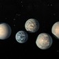 An illustration of the seven planets around a small star 40 light-years from Earth