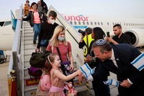 Passengers disembark from an airplane carrying Jewish immigrants fleeing the war in Ukraine, upon their arrival in Israel.