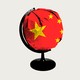 An image of a global with the Chinese flag covering it