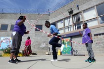 An inmate plays jump rope with her 10-year-old daughter and cousin at the Folsom Women's Facility in Folsom, California.