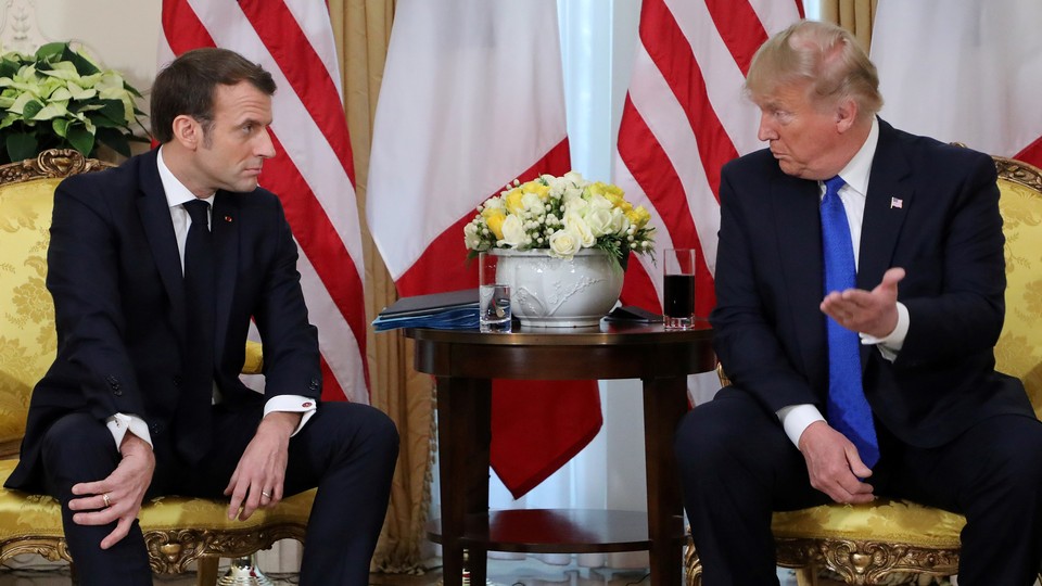 Emmanuel Macron talks with Donald Trump.