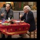 Larry David eating at a restaurant with two friends