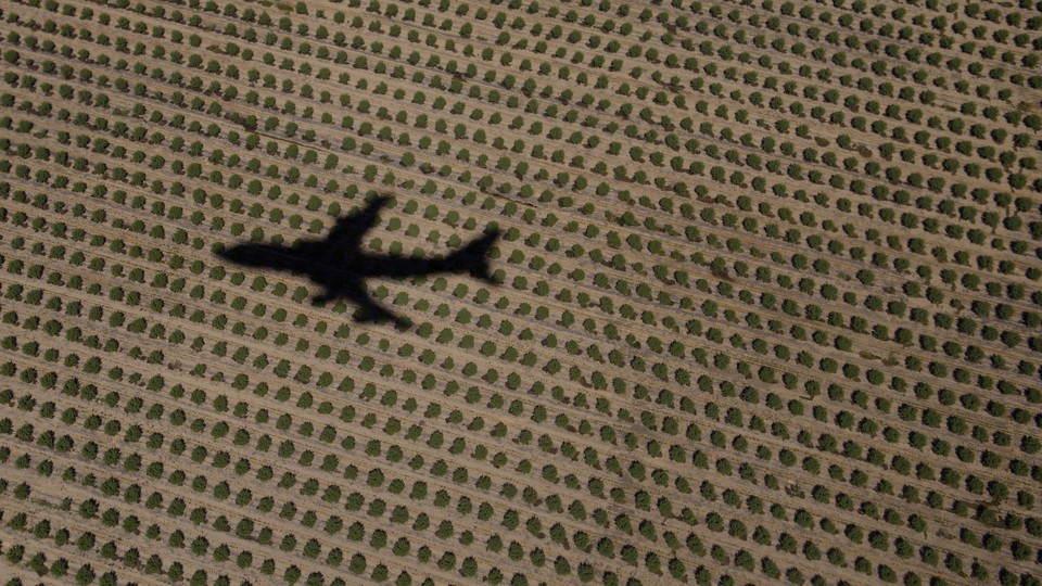 A shadow of a plane flying over rural land