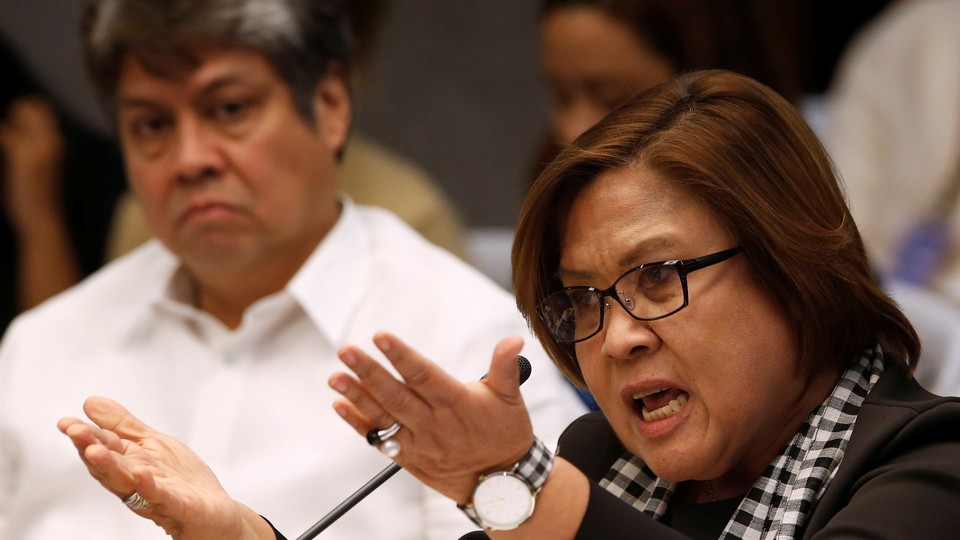 Senator Leila de Lima speaks at a Senate hearing regarding people killed during a crackdown on illegal drugs.