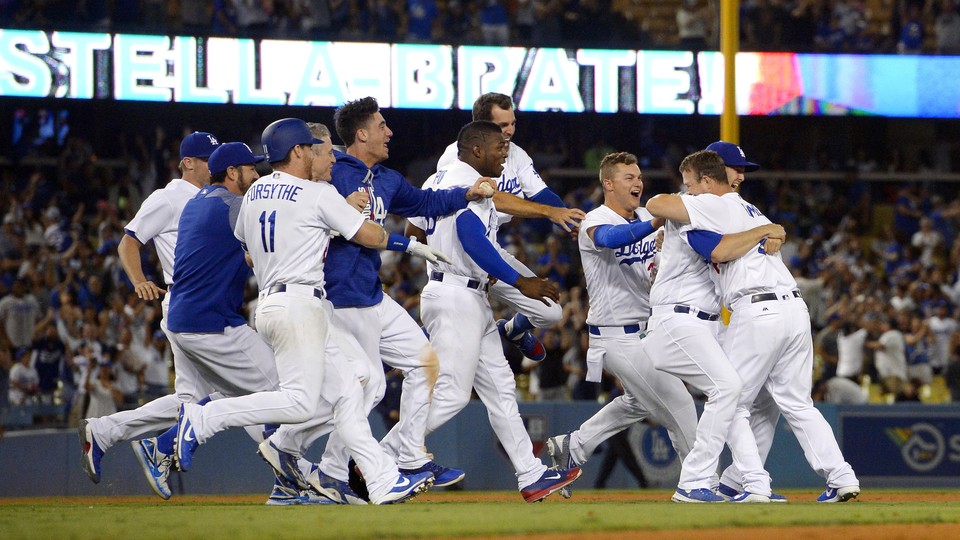 The Dodgers celebrate a win against the San Francisco Giants.