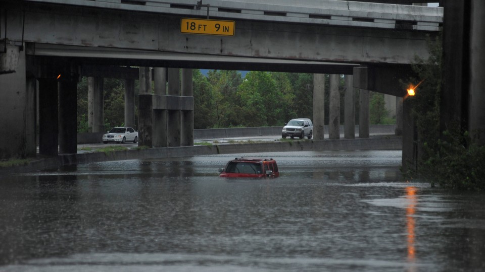 An abandoned Hummer is covered in floodwaters on Interstate 610 after Hurricane Harvey inundated the Texas Gulf coast with rain.