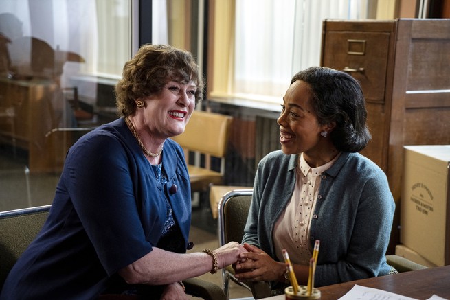 Sarah Lancashire as Julia Child, grinning and holding the hand of a friend in "Julia"