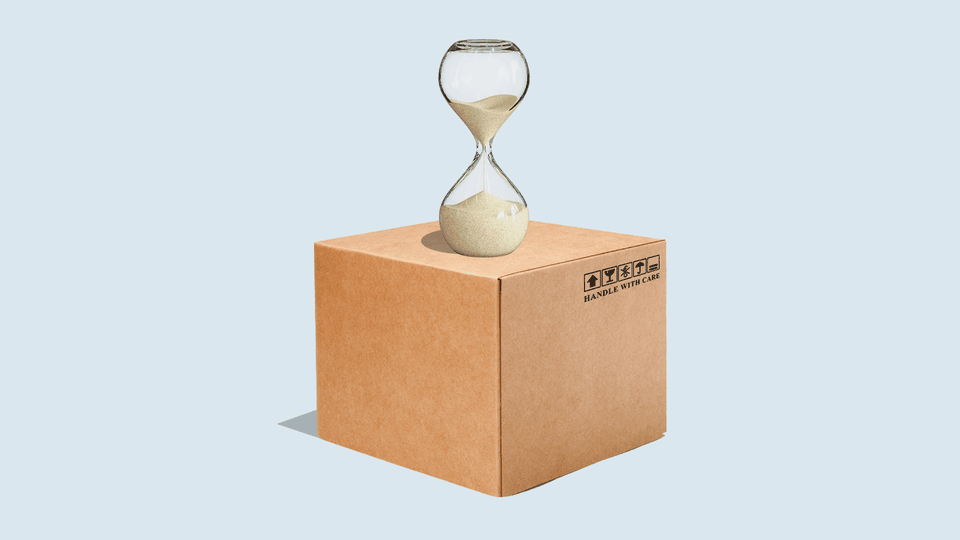 An illustration of a cardboard box with an hourglass on top