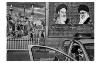 A mural on an exterior city wall in Iran shows Ayatollahs Khomeini and Khamenei.