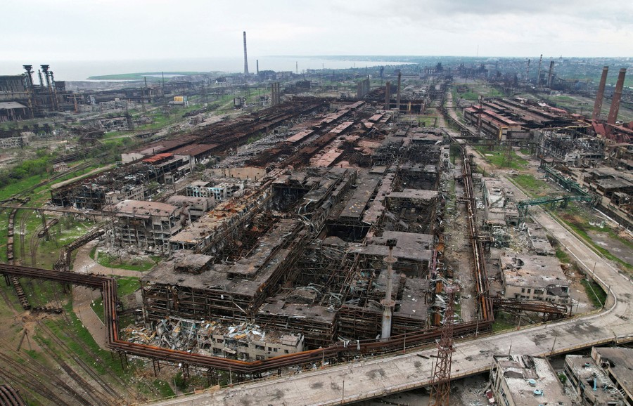 An aerial view of heavily damaged industrial buildings