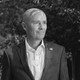 A black-and-white portrait photo of Utah Governor Spencer Cox