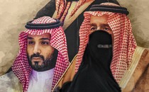 woman in niqab and abaya looks at camera while walking past a larger-than-life-size poster of the royal family