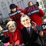 Protesters wear masks of U.S. President Barack Obama and German Chancellor Angela Merkel as they demonstrate against the TTIP in Hanover in April.