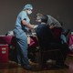 Staff at Temple University Hos​pital receive the coronavirus ​vaccine in Philadelphia, Dec. ​16, 2020.