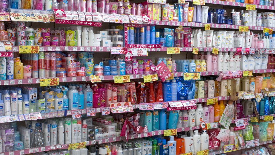 Rows of colorful cosmetics bottles