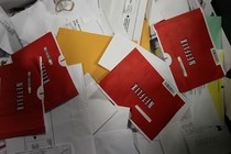 Netflix envelopes on a pile of mail