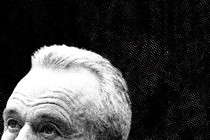 Black and white photo of the top half of Robert F. Kennedy Jr.'s head against a black background