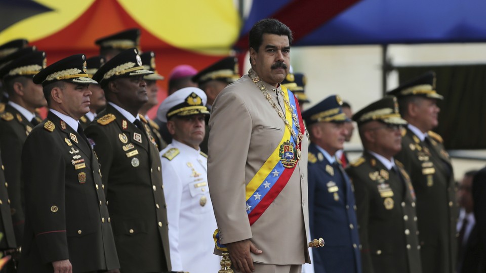 Maduro and military officers in uniform