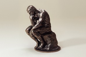 An image of a sculpture of "The Thinker"