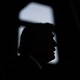 Photograph of Trump's side profile in silhouette.