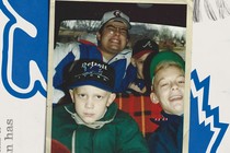 image of Tim Alberta in a Lions hat as a child with family