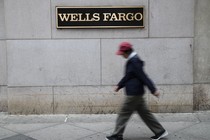 A person walks past a Wells Fargo location in Philadelphia.