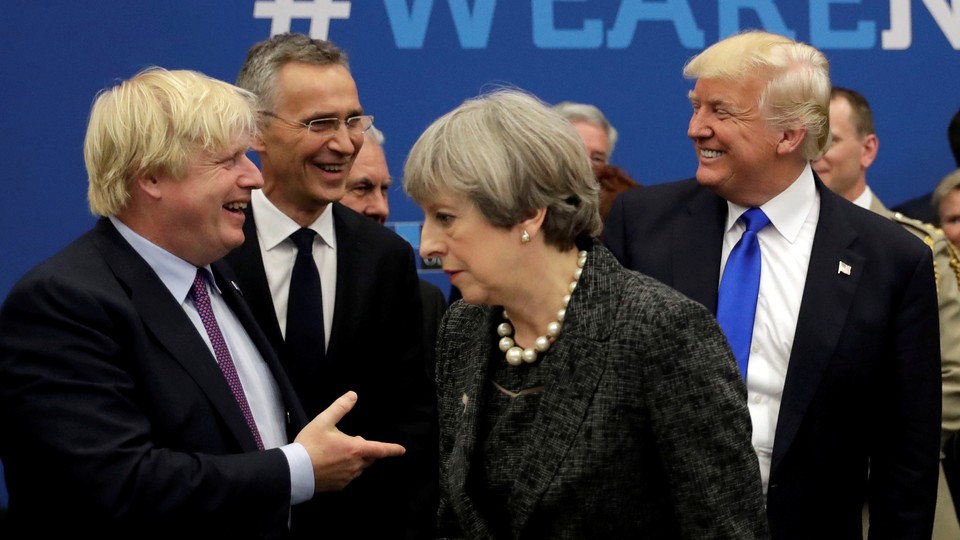 Boris Johnson greets Donald Trump; Theresa May faces away.
