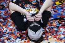 Caitlin Clark lays down on a floor covered in confetti