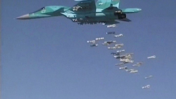 A Russian Sukhoi Su-34 fighter-bomber based at Iran's Hamadan air base, drops bombs in the Syrian province of Deir ez-Zor.