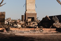 A photo of a burned-out home in California after a wildfire.