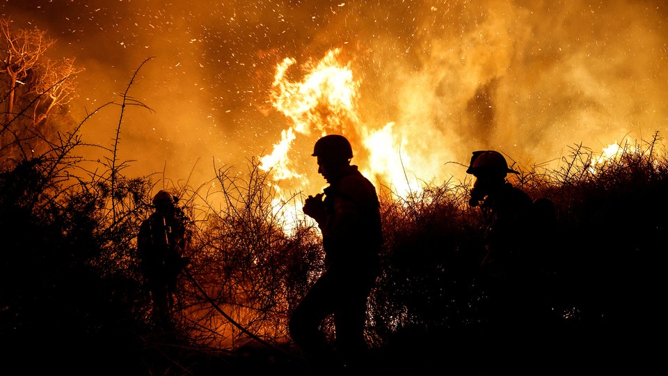 Firefighters battle a blaze.