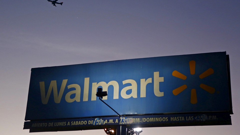 A sign advertising a Walmart store