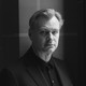 A black-and-white image of Christopher Nolan